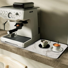 Coffee pot mat instantly covers water, coffee and milk stains Rubberized bottom, non-slip and easy to clean